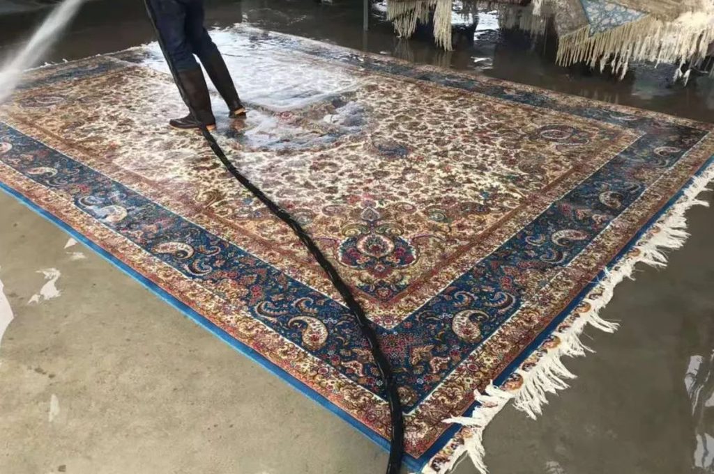 Handmade silk rug undergoing professional full-rug cleaning
