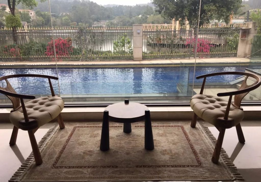Handmade silk rug positioned near a large window